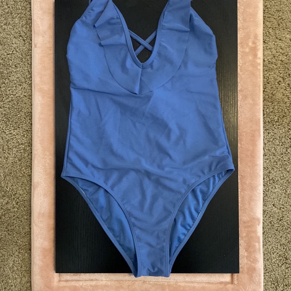 One-piece high waist cut and v-neck ruffle detail